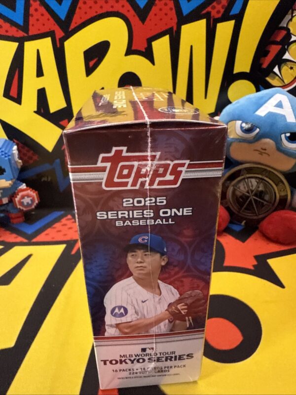 A box of topps baseball cards sitting on top of a table.