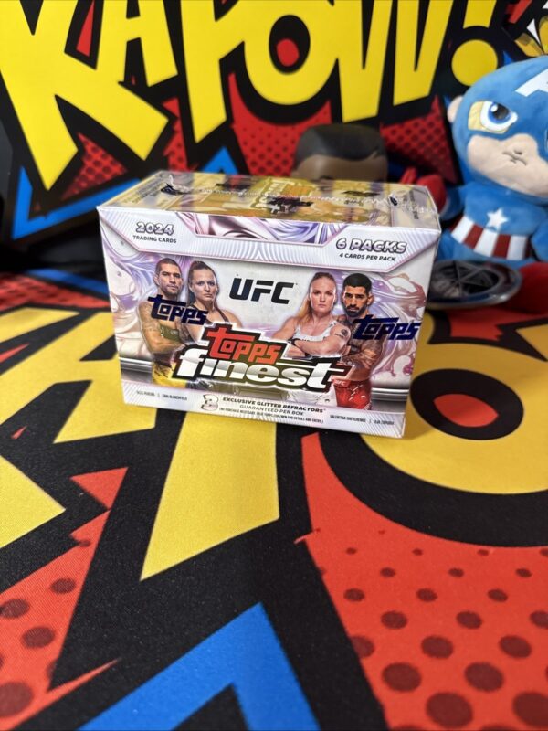 A box of topps finest ufc trading cards
