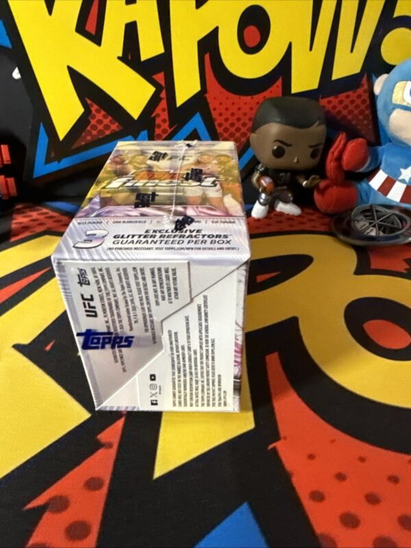 A funko pop figure sitting on top of a box.
